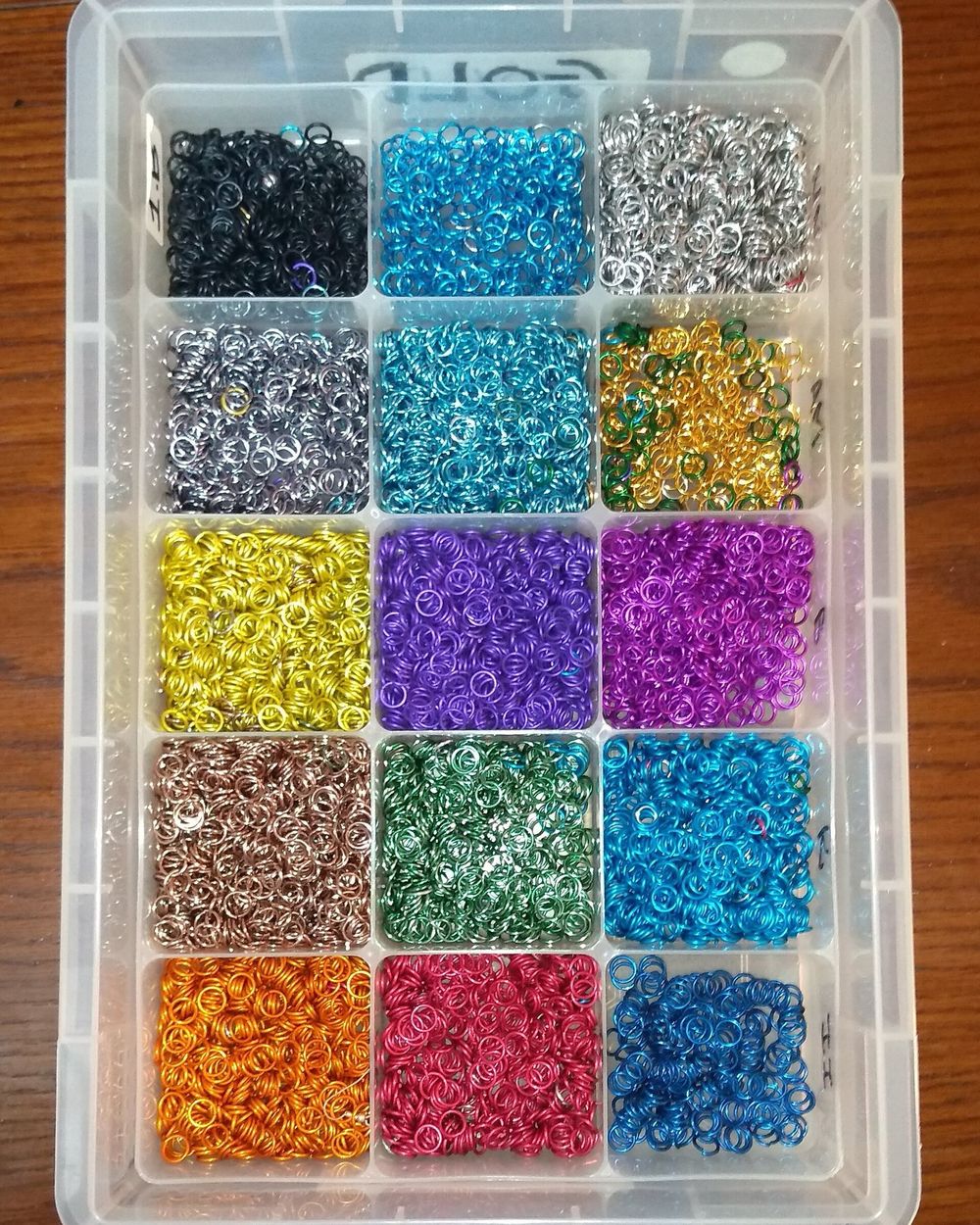 Colored anodized aluminum parts - the anodic layer grows out of the metal itself, so it cannot chip or peel the way paint and powder coating do.