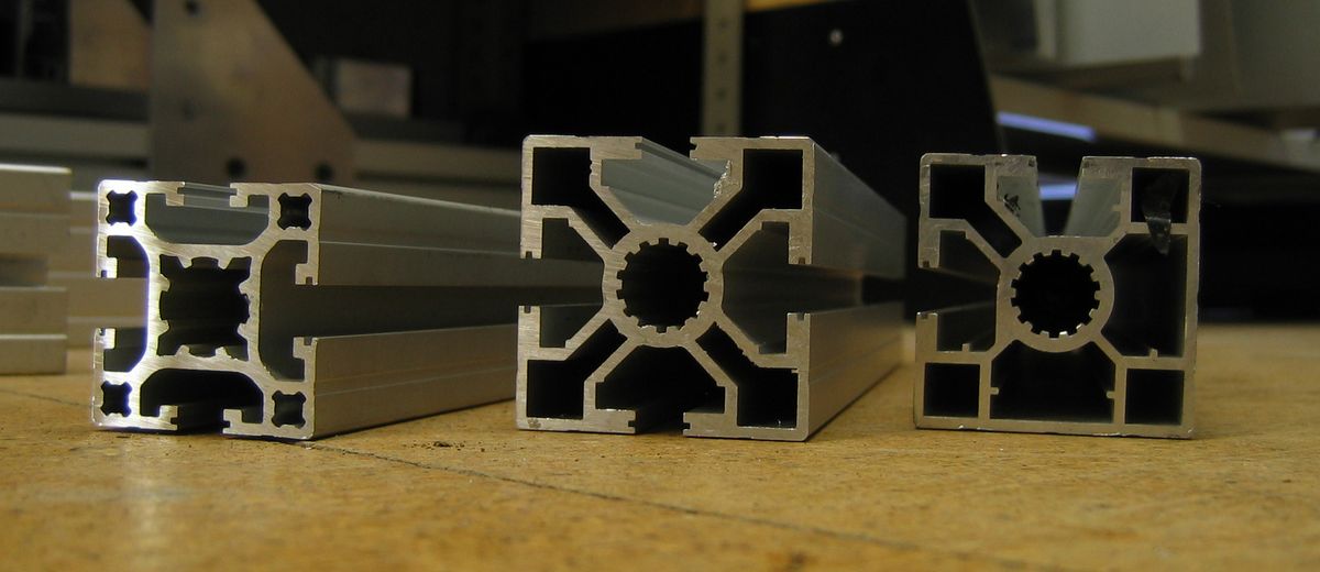 Extruded aluminum hollow sections with internal chambers - each internal wall adds stiffness, which is how thin 1.5-2.0 mm walls still pass crush tests.