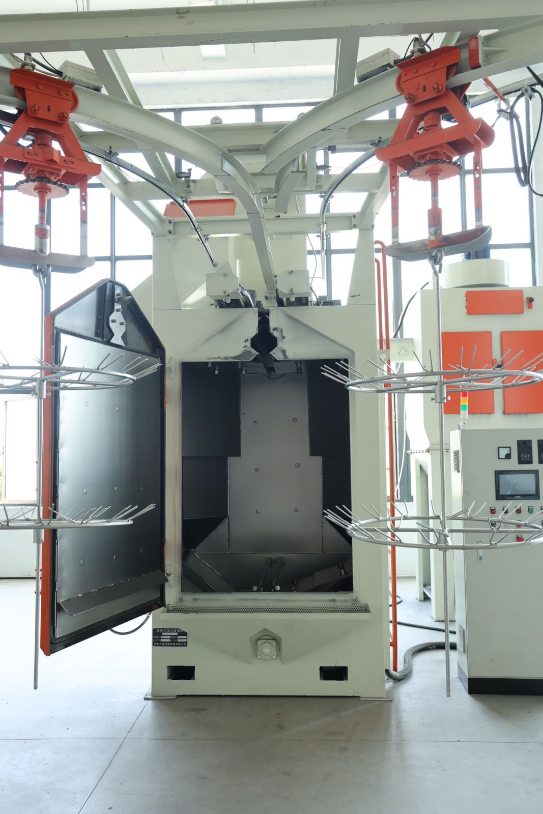 Automated parts cleaning and deburring station for aluminum battery box components